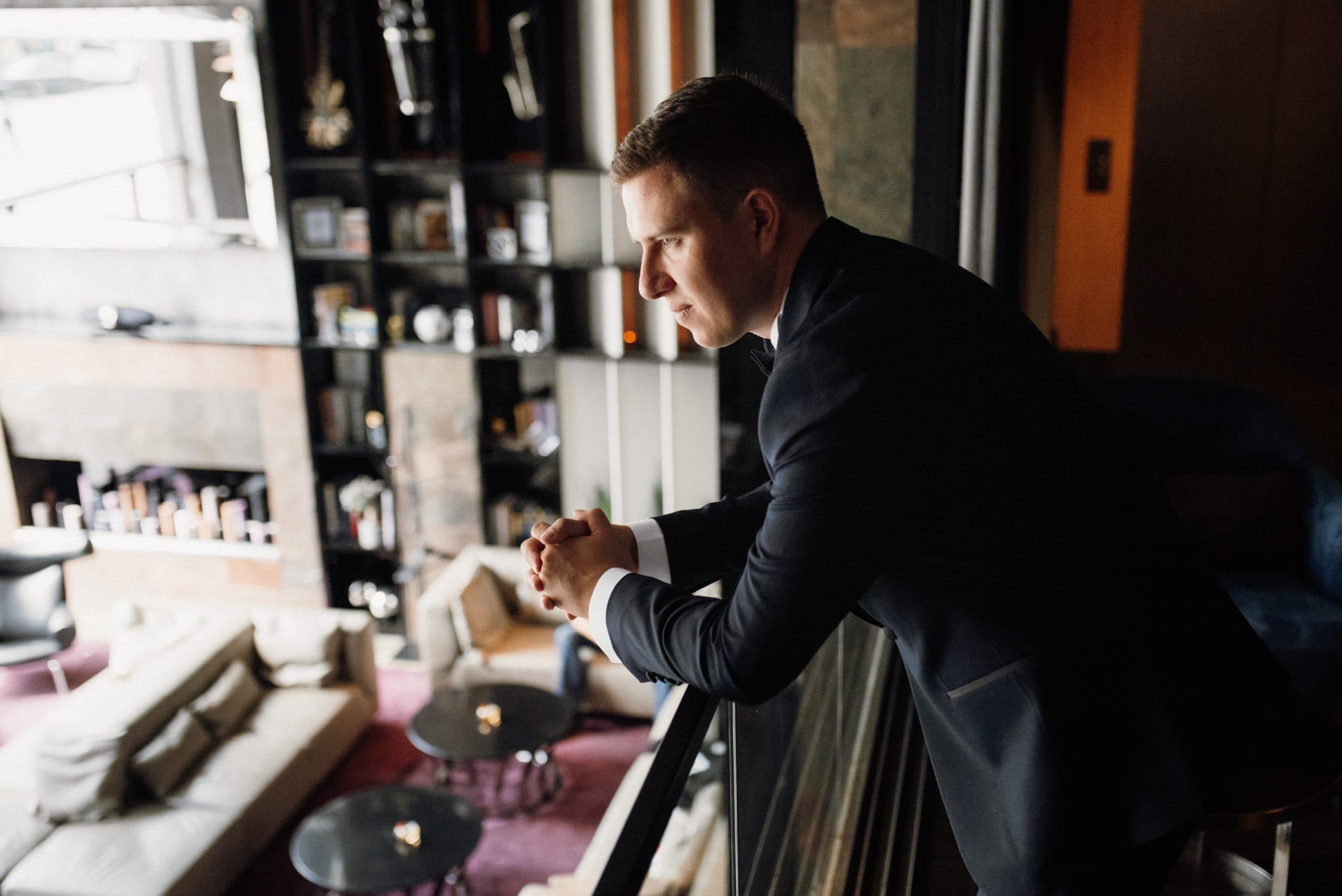 Well-dressed man in a luxury Toronto hotel lounge considering his escort experience